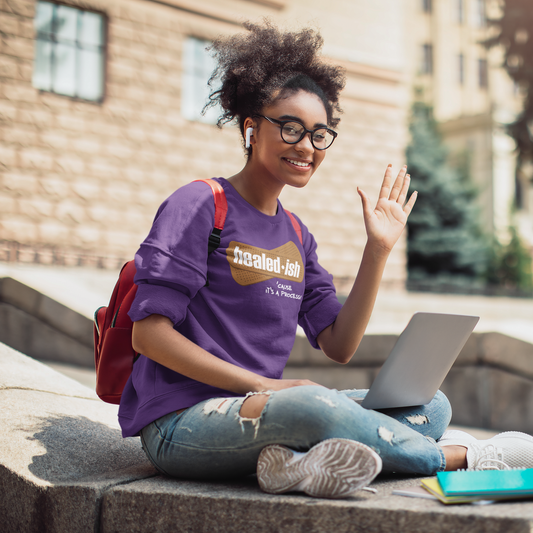 female college student with a bookbag wearing a healed-ish sweatshirt