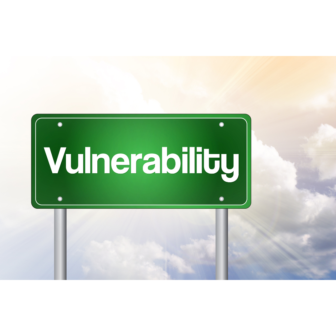 a green highway sign that reads vulnerability