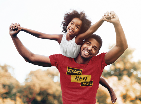 man playing with his daugther wearing a Strong Men Heal t-shirt