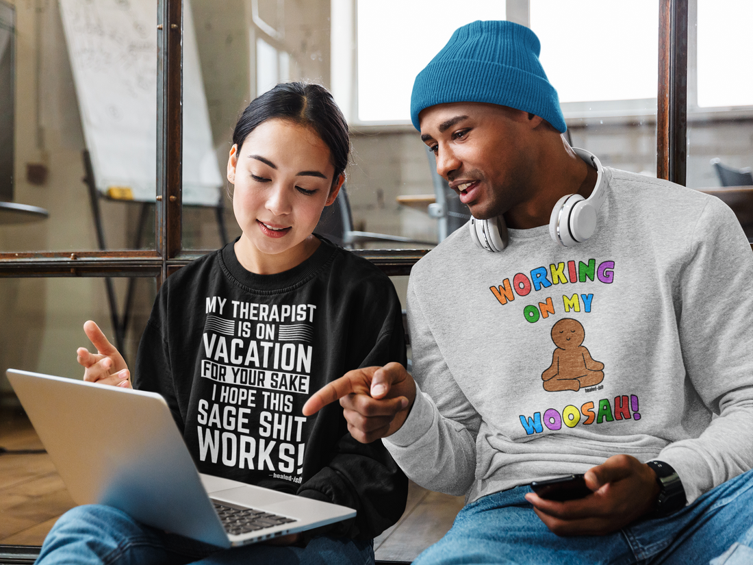 a woman and a man wearing healed-ish trendy sweatshirts with sayings