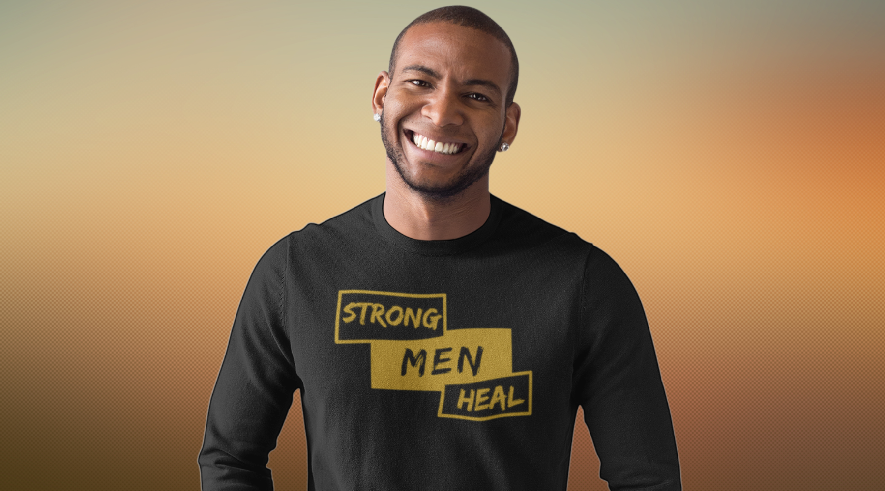 Man wearing a black Strong Men Heal Self-care Sweatshirt