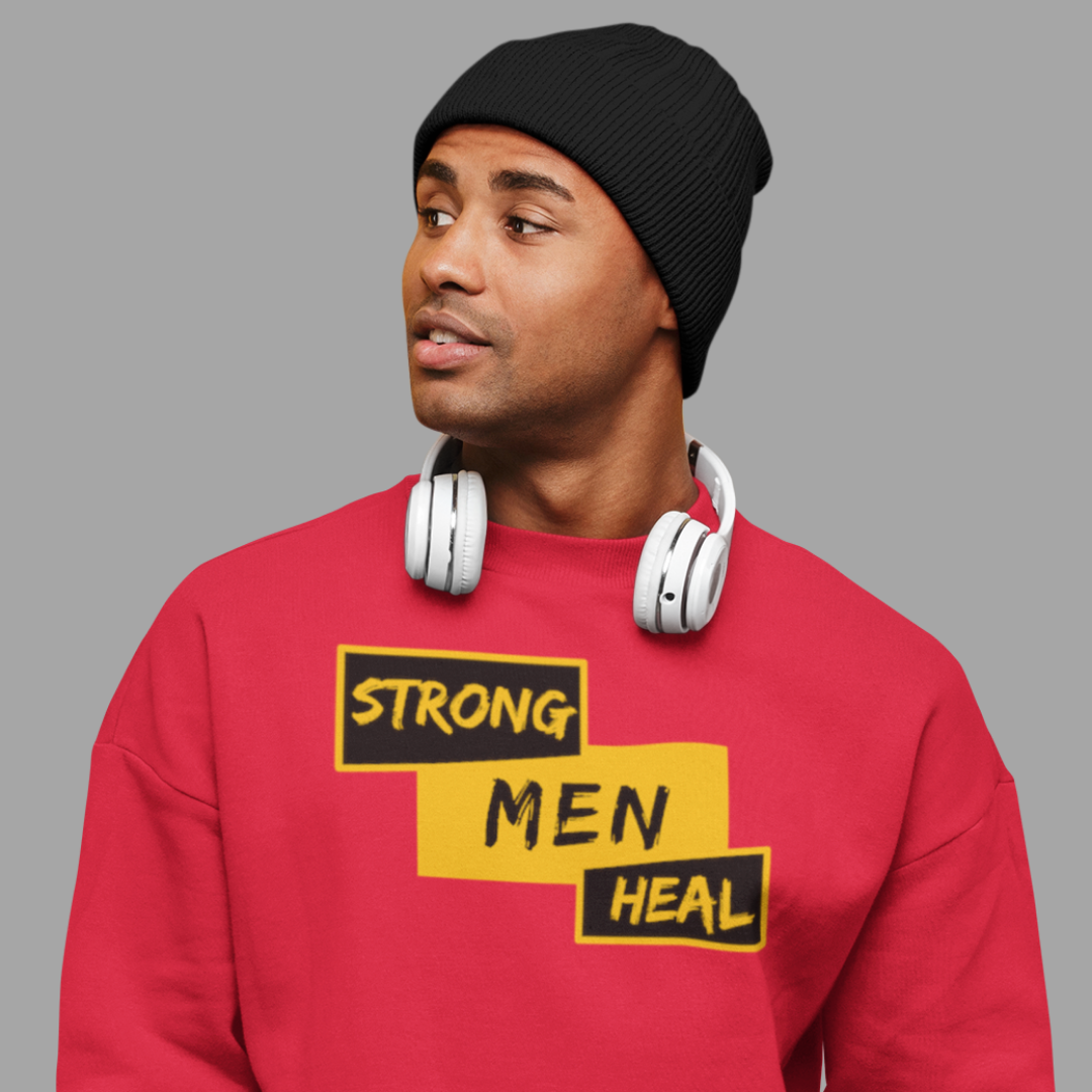 A man wearing a Strong Men Heal red sweatshirt