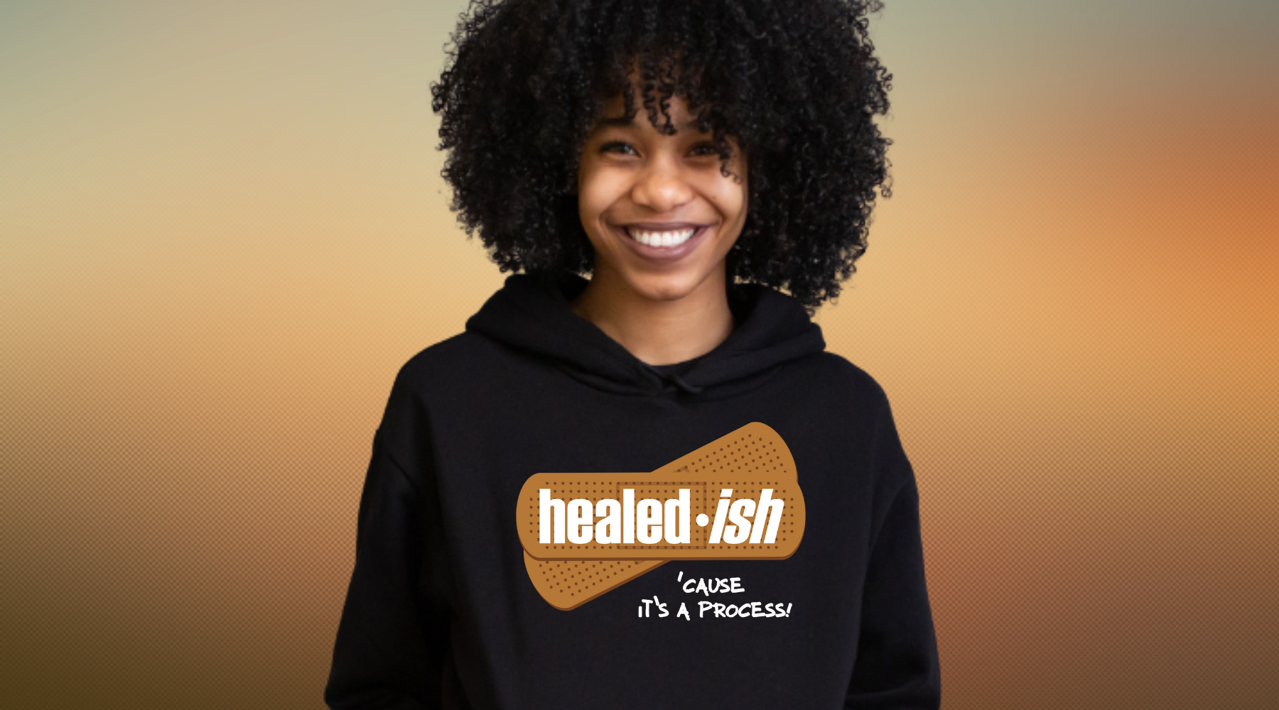 Woman wearing a black healed-ish mental health hoodie
